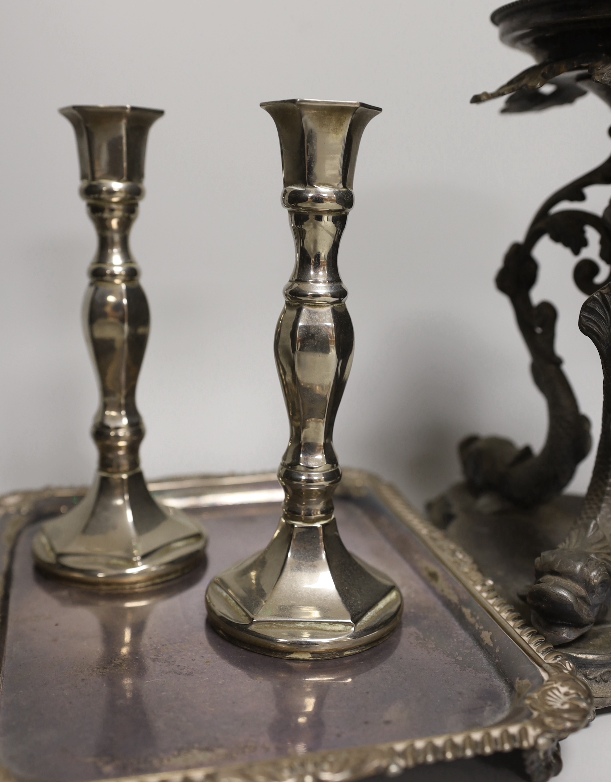 A pair of silver plated Philip Ashberry & Sons dolphin tazza’s, impressed 656 to the bases, together with a tray and pair of candlesticks, the largest each 23cm high